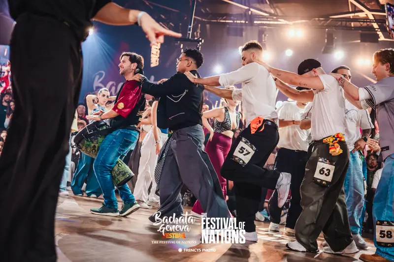 Finalists dancing in a line across the floor