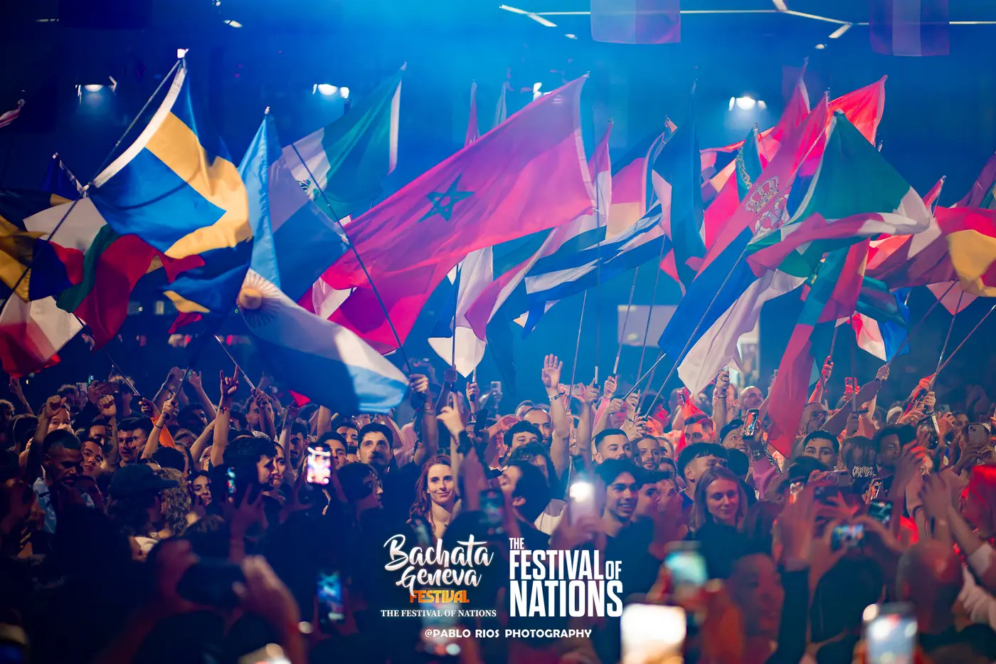 Hundreds of national flags waving over the crowd at the Parade of Nations