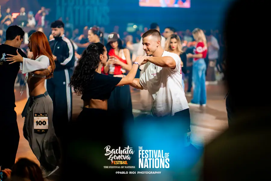 A couple dancing with bibs during a heat